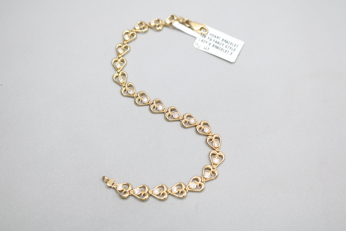 10k Yellow Gold Heart Fancy Lady's Bracelet w/clear stones (Length 7")