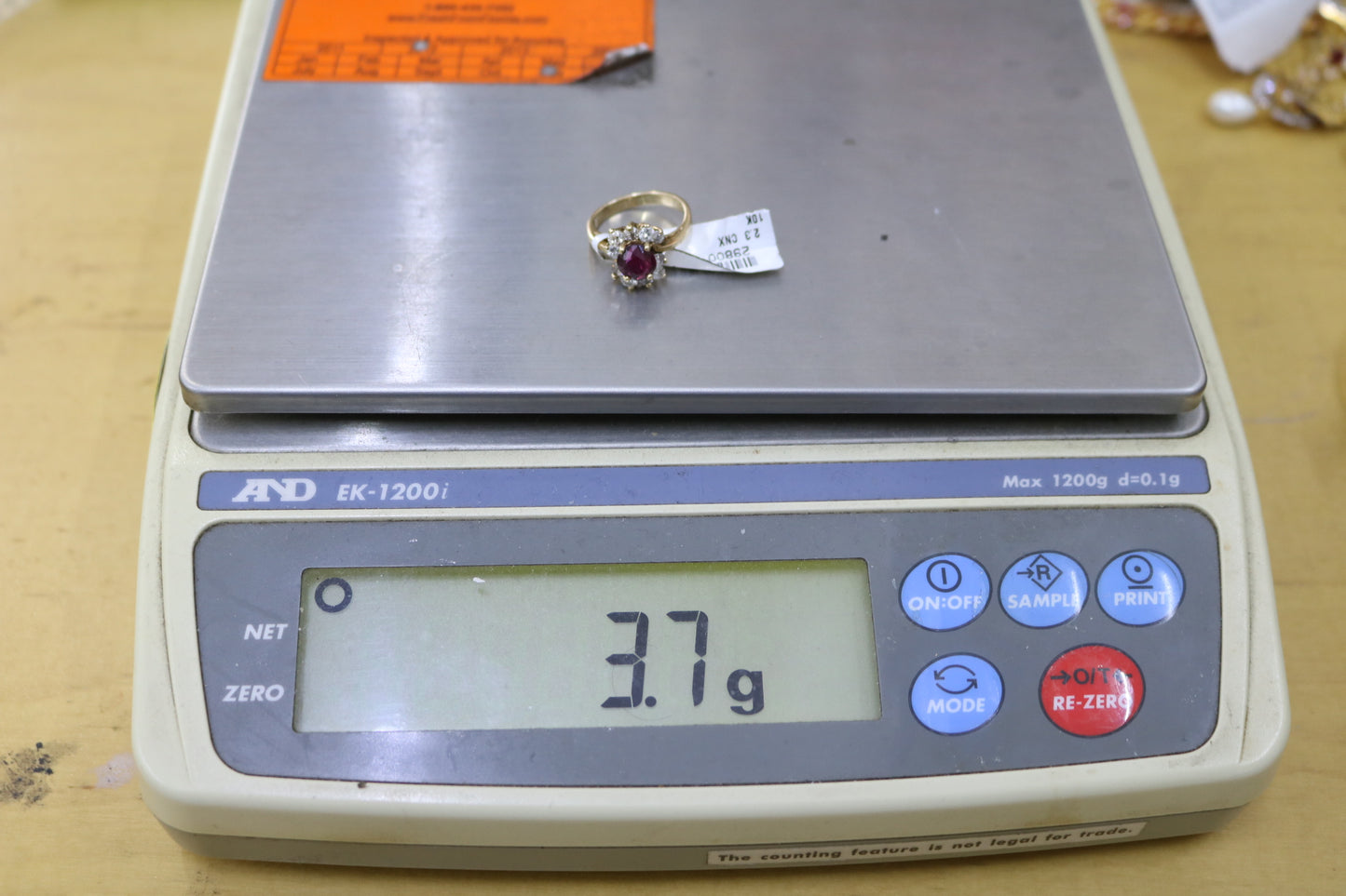 10K Yellow Gold Diamond Halo Ring with center Ruby (Size 5)