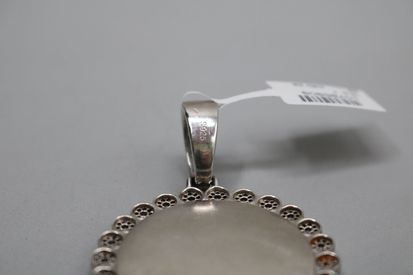 Sterling Silver Circular Charm with Clear Stones