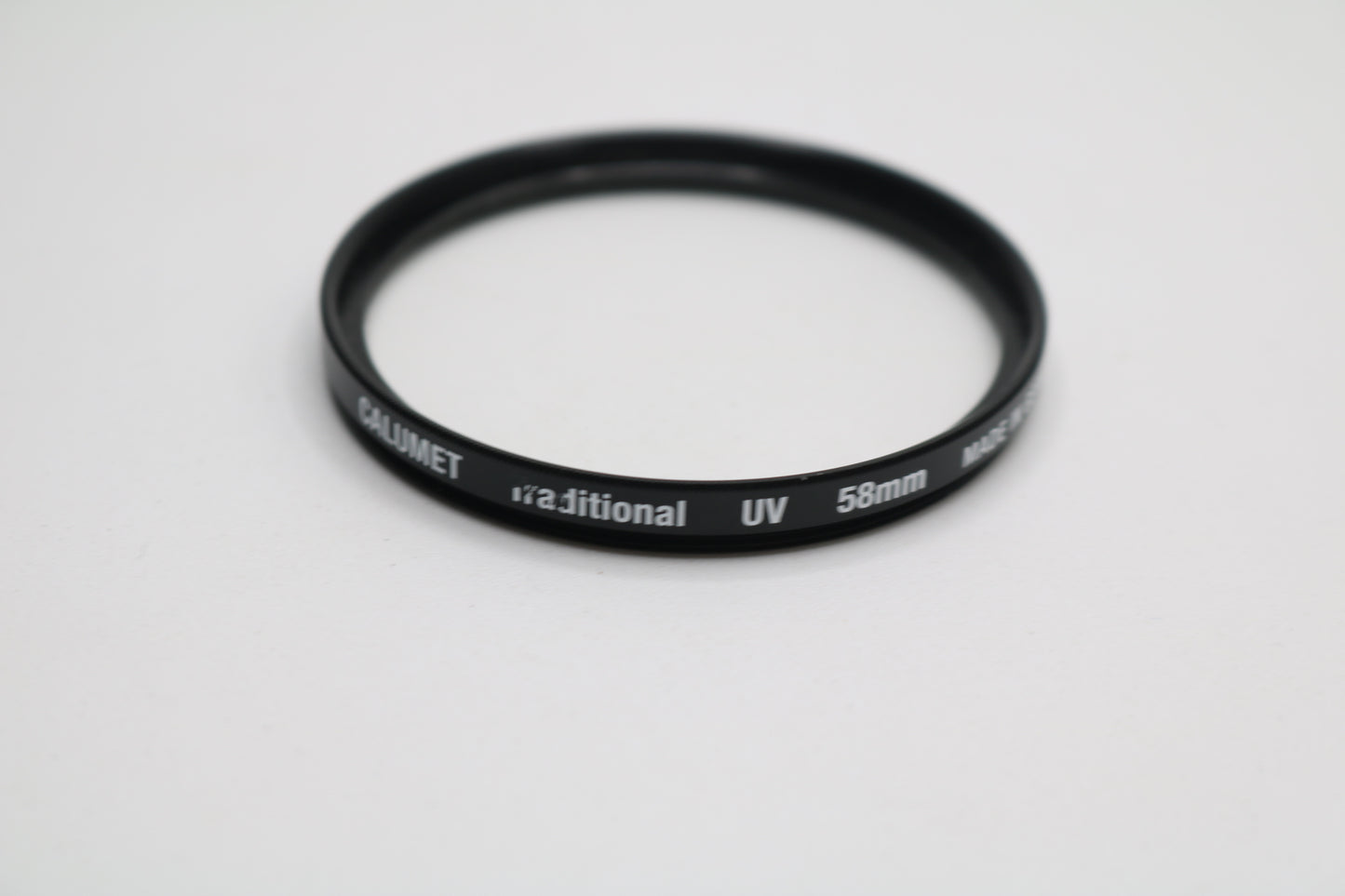 UV lenses Hoya 52mm, Camulet 58mm, and Promaster 58mm