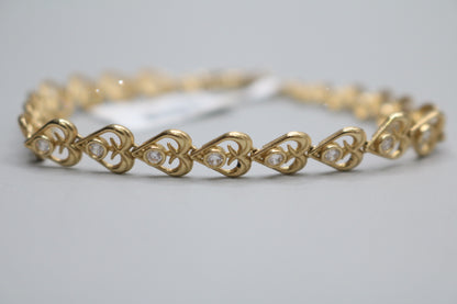 10k Yellow Gold Heart Fancy Lady's Bracelet w/clear stones (Length 7")