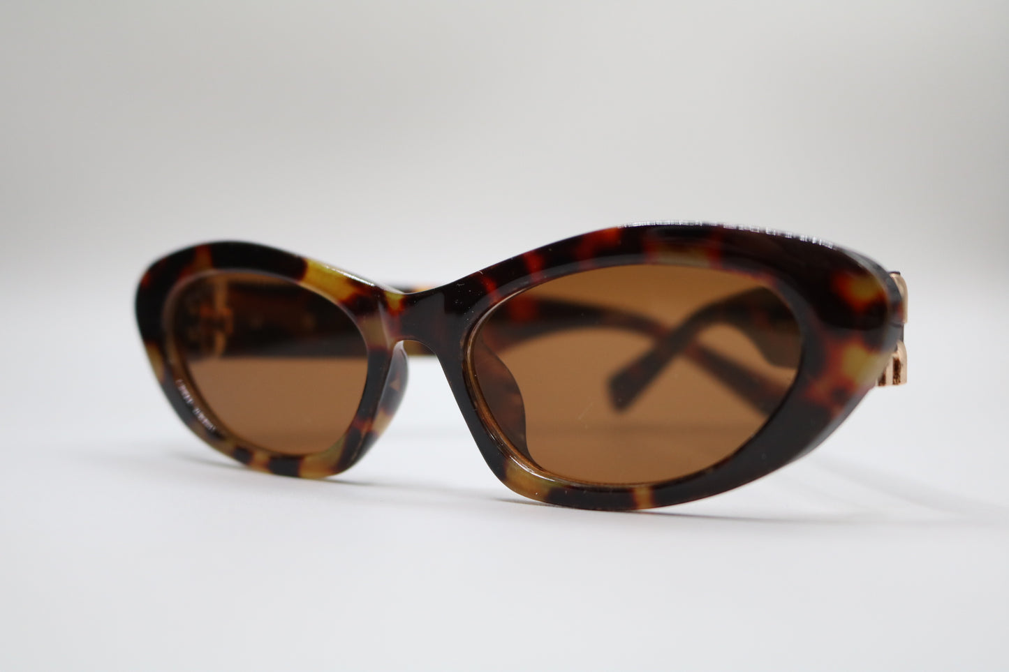 Miu Miu MU 09YS Honey Havana/Dark Brown (VAU0/6B) Sunglasses