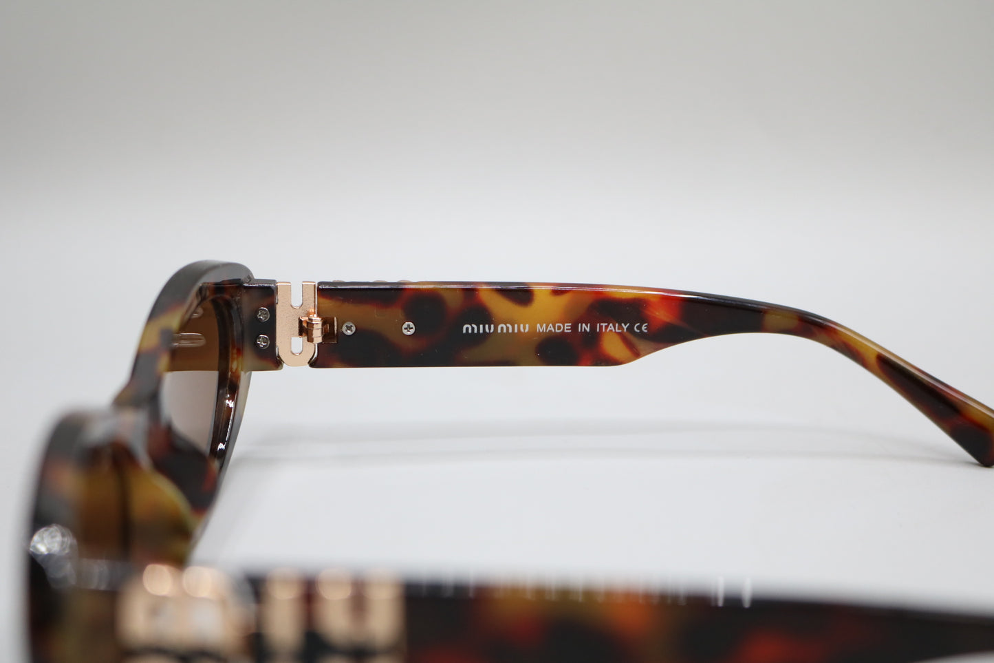 Miu Miu MU 09YS Honey Havana/Dark Brown (VAU0/6B) Sunglasses