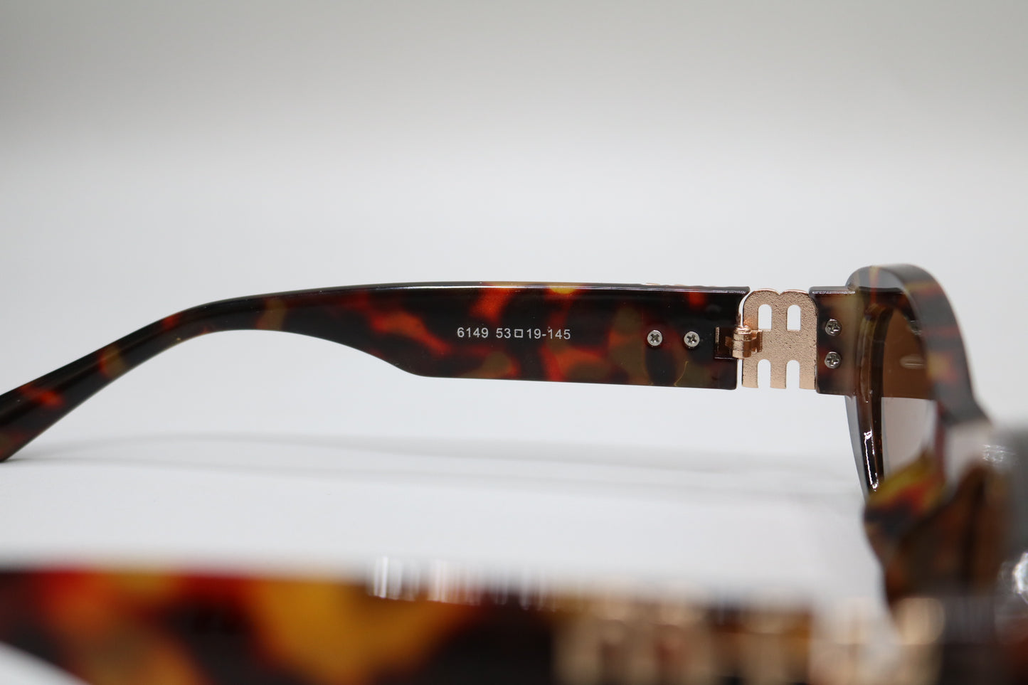 Miu Miu MU 09YS Honey Havana/Dark Brown (VAU0/6B) Sunglasses