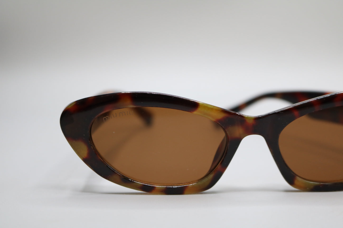 Miu Miu MU 09YS Honey Havana/Dark Brown (VAU0/6B) Sunglasses
