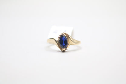 10k Yellow Gold Blue Stone Bypass Ring (Size 6 1/2)