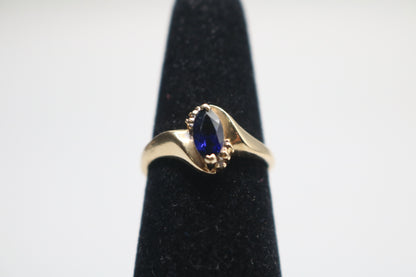 10k Yellow Gold Blue Stone Bypass Ring (Size 6 1/2)