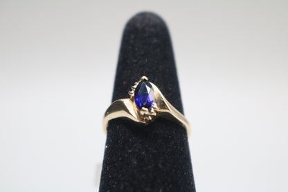 10k Yellow Gold Blue Stone Bypass Ring (Size 6 1/2)