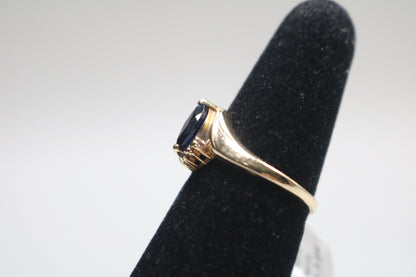10k Yellow Gold Blue Stone Bypass Ring (Size 6 1/2)