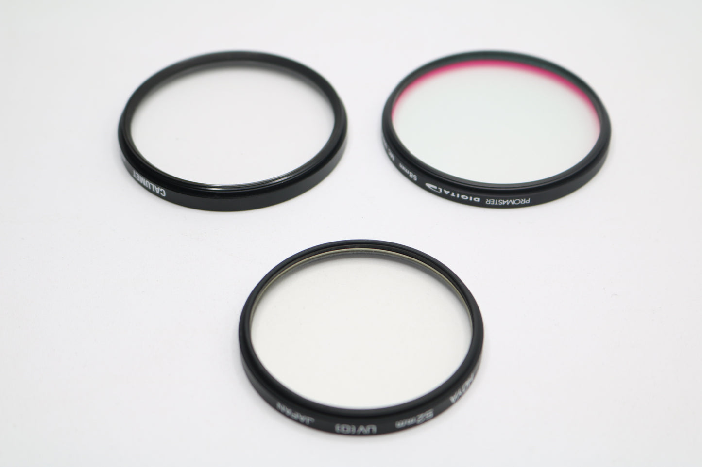 UV lenses Hoya 52mm, Camulet 58mm, and Promaster 58mm