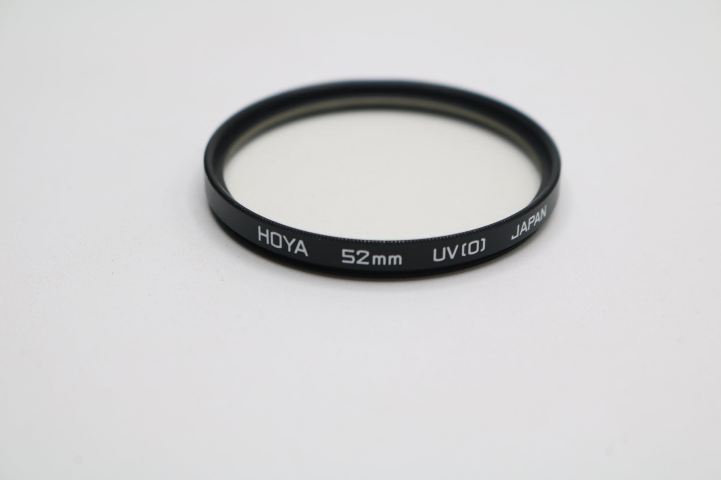 UV lenses Hoya 52mm, Camulet 58mm, and Promaster 58mm
